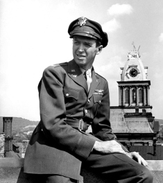 09-24-1945 LIFE cover of uniformed pilot and actor, Col. Jimmy Stewart, sitting outside on top of bldg. in hometown, upon his return from WWII; photo by Peter Stackpole.