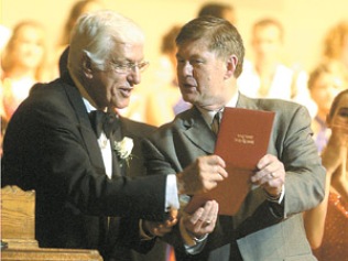 Van Dyke receives his high school diploma from Superintendent Gary Tucker after the performance. Van Dyke said he never picked up his diploma before going into the U.S. military in March of 1944. Photo by Matt Huber