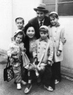 19 Dec 1954, London, England, UK --- Actress Jeanne Crain and her husband Paul Brinkman with their four children: Paul, Michael, Timothy and Jeanine at London Airport, 1954. --- Image by © Hulton-Deutsch Collection/CORBIS